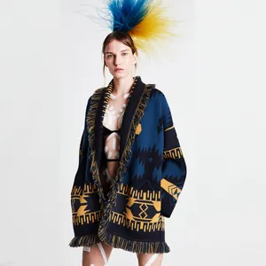 Detailed view of bohemian jacquard wool cardigan with fringe trim and geometric pattern
