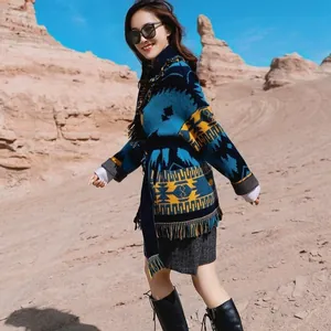 Elegant bohemian style wool jacquard long cardigan worn by model in desert landscape