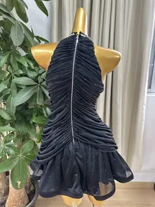Detailed back view of a black halter rhinestone dress with pleats and a long zipper