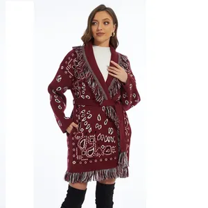 Close-up detail of the burgundy bohemian fringe cardigan featuring vintage jacquard pattern