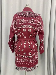 Detailed back view of wine red oversized jacquard cardigan with fringe and belt details