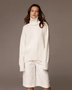 Elegant white oversized turtleneck knit sweater for women in premium studio view