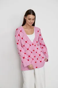 Cozy pink knit cardigan featuring a charming red heart and diamond jacquard pattern