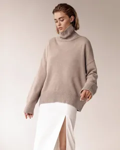 Model wearing oversized turtleneck knit sweater in oatmeal beige for autumn style