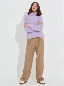 Detailed view of a thick purple ribbed turtleneck knit sweater for autumn and winter