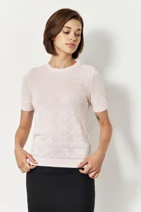 Detail shot of a light pink crewneck short-sleeve knit sweater with textured patterns