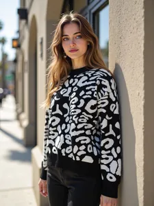 Close-up of the black and white leopard print pattern on this cozy knitted winter sweater