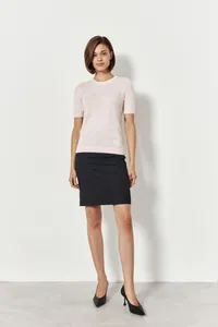 Classic women's pale pink short sleeve knit sweater with soft texture and crew neck