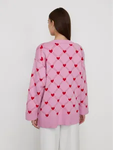 Women's pink oversized knitted cardigan with red heart jacquard pattern and argyle design