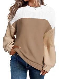Women's color-block knit sweater with lantern sleeves and a classic crew neck design.