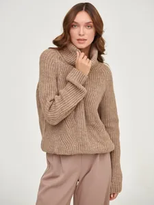 Chunky camel-colored turtleneck knit sweater with a loose fit for cozy winter warmth