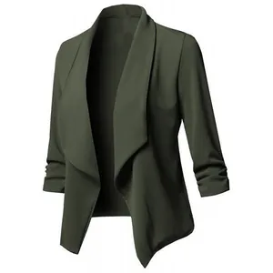 Close-up of women's dark green blazer with draped shawl collar and ruched sleeves