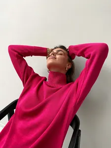 Detailed macro view of vibrant fuchsia ribbed texture on thick turtleneck sweater