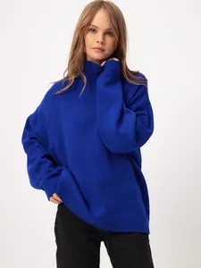 Professional studio shot of a royal blue oversized high-neck knit sweater for women