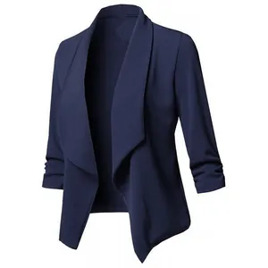 Detail of ruched 3/4 sleeves and draped lapel on a navy blue casual women's blazer