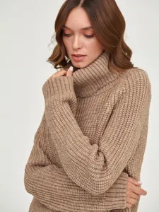 Close-up of thick brown chunky-knit turtleneck sweater for autumn and winter