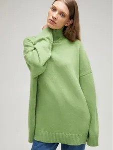 Stylish oversized lime green turtleneck knit sweater for women in a premium studio photoshoot
