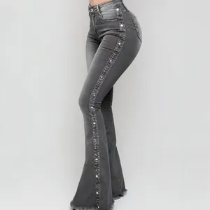 Grijze stretch flare jeans met hoge taille, zijknopen en een gerafelde zoomrand