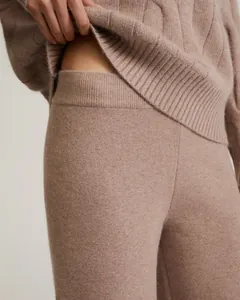 Detailed high-quality close-up showing the soft texture of dusty rose knit sweater pants set