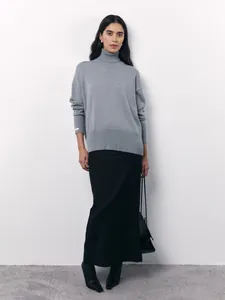 Elegant women's loose gray turtleneck knit sweater for chic autumn and winter outfits