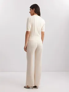 Elegant cream short-sleeve polo knit sweater for women, professional back view silhouette