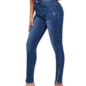 Jeans skinny a vita alta da donna con fondo a fessura decorato con perline e denim elastico