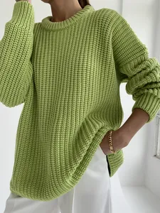 Detailed view of women's lime green oversized chunky knit sweater texture