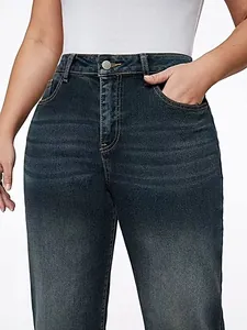 Macro detail of vintage washed high-waisted straight-leg blue denim jeans for women