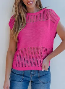 Detailed macro view of the pink hollow-out knit sweater showing the intricate mesh pattern
