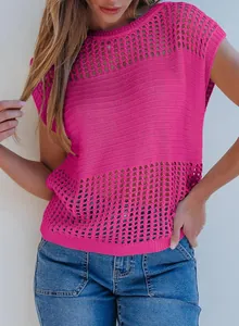 Detail view of the vibrant pink knit sweater with delicate hollow-out mesh patterns.