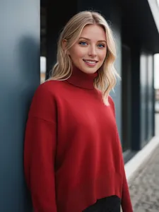 Detailed shot of a red loose-fit turtleneck knit sweater with thick ribbed texture