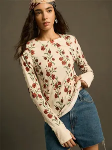 Detail view of the vintage floral print on a slim fit long-sleeved knitted T-shirt