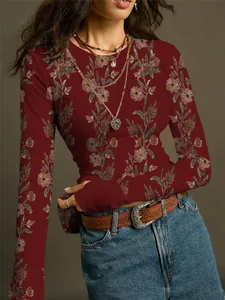 Close-up of vintage floral print on a burgundy ribbed knit long sleeve T-shirt