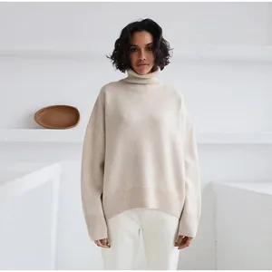 Elegant oversized cream turtleneck knit sweater for women, autumn winter fashion