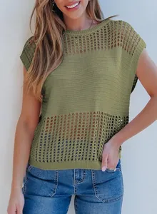 Detailed view of the intricate green hollow-out knit texture on a casual summer sweater top
