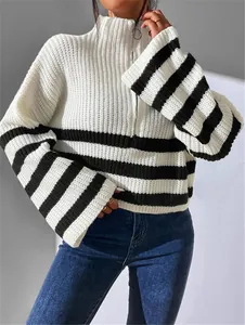 Close-up of striped color-block knitted sweater with stand collar and zipper detail.