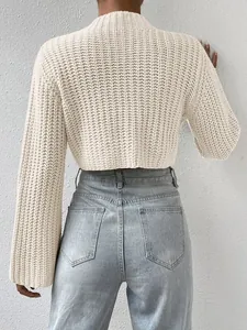 Detailed back view of a cream cropped chunky knit sweater featuring elegant flare sleeves.