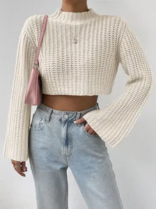 Close-up of off-white cropped knit sweater featuring trendy bell sleeves and mock neck