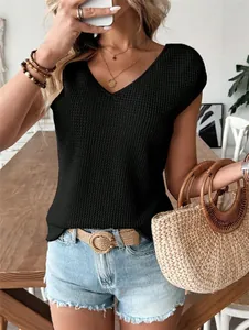 Detail view of women's black waffle-knit V-neck short sleeve top for casual summer style