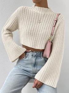 Detail shot of a beige chunky knit cropped sweater featuring stylish flared sleeves