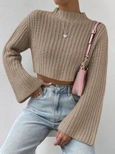 Close-up of a beige cropped mock neck knit sweater with stylish bell sleeves