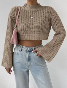 Detailed view of women's beige knit crop sweater with bell sleeves and mock neck