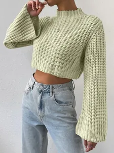 Close-up of sage green waffle knit cropped sweater with flared sleeves