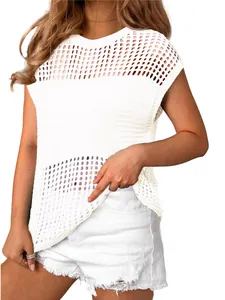 Detailed view of the white hollow-out mesh knit texture on a chic summer top
