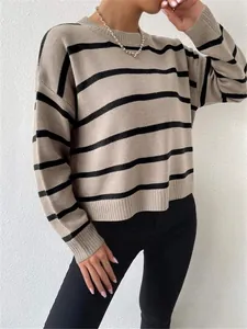 Detailed view of a loose-fitting khaki and black striped knit pullover with round neck