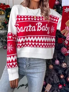 Detail of red and white knitted Christmas sweater with 'Santa Baby' text pattern
