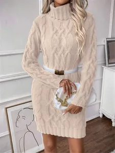 Close-up of cable-knit texture on a slim-fit turtleneck sweater dress with belt accessory