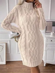 Detailed view of beige high-neck cable knit long sleeve sweater dress for winter