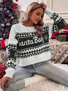 Close-up of a festive black and white Christmas sweater with 'Santa Baby' text.
