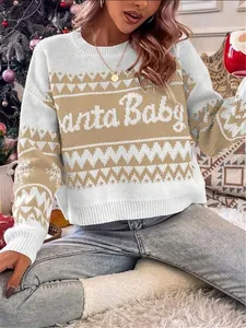 Close-up detail of a festive Fair Isle knitted Christmas sweater with 'Santa Baby' text.
